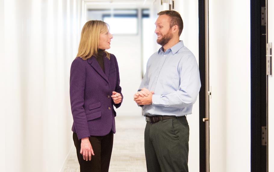 JMG Members Talking in Hallway