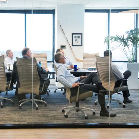 Boardroom Staff Discussing Financial Services